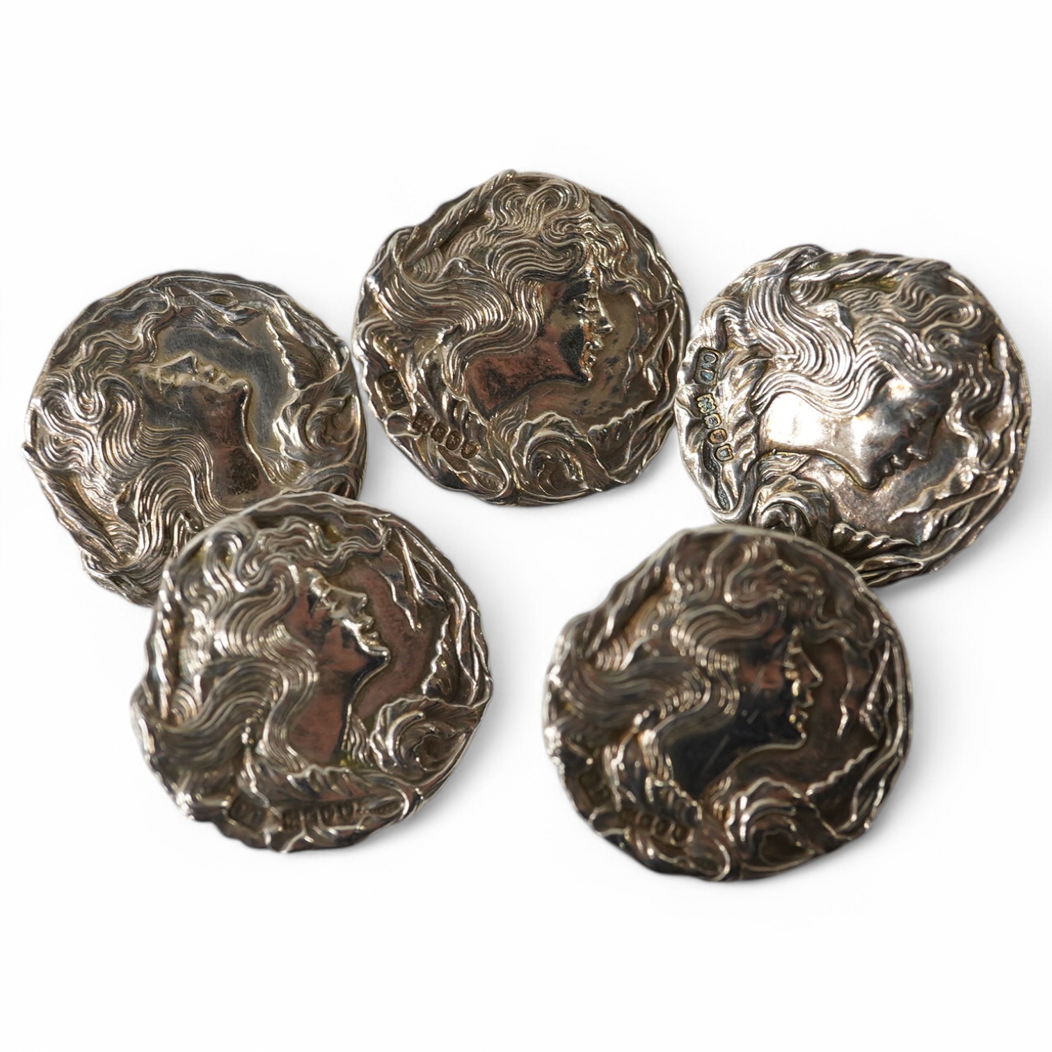 A set of 5 Edwardian Art Nouveau imported silver buttons decorated with maidens heads, Charles Henry Dumenil, London 1904, 28mm. Condition - good